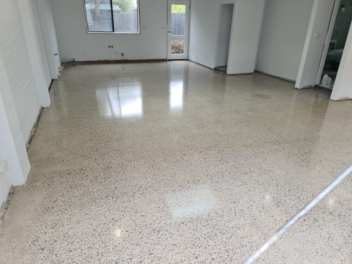 Finished grind and seal concrete floor in a converted garage space