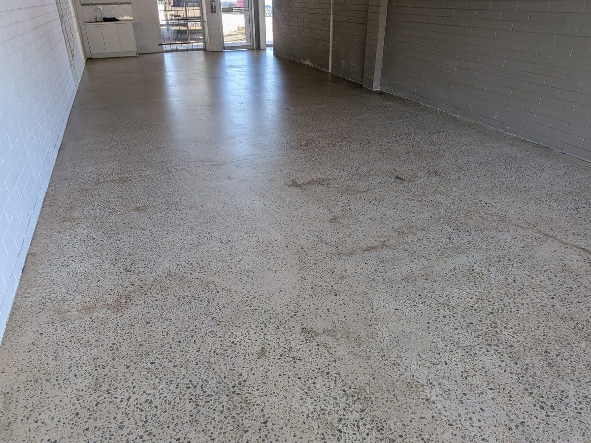 Grind-and-seal floor in an open-plan living area, the finish the article compares with mechanical polishing