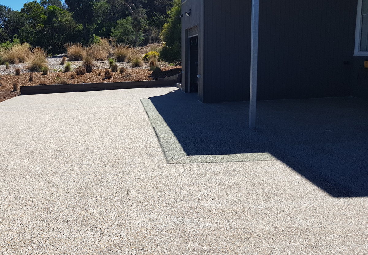 Exposed-aggregate external concrete finish in full sunlight