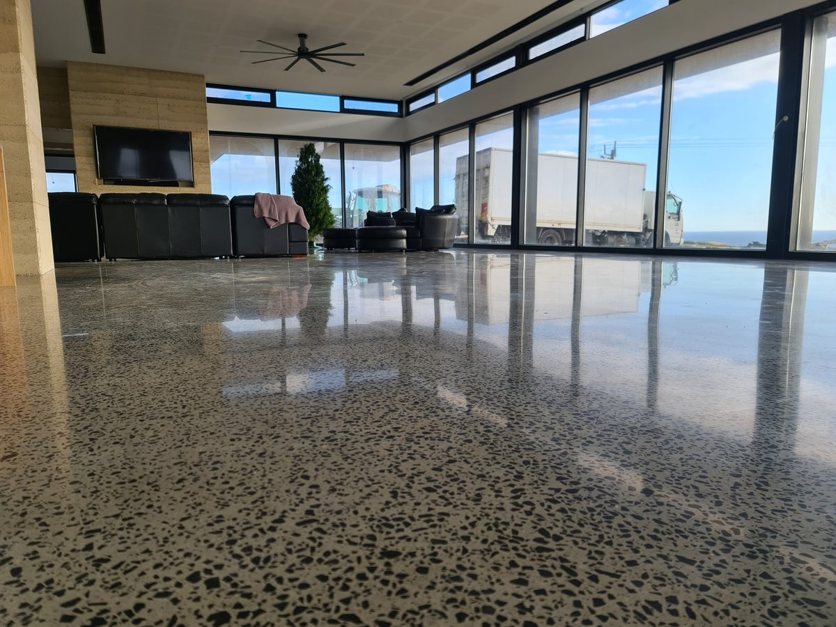 Polished concrete floor in a living room, showing how aggregate and tone vary across a single slab